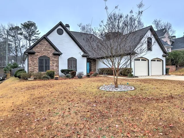 a front view of a house with a yard