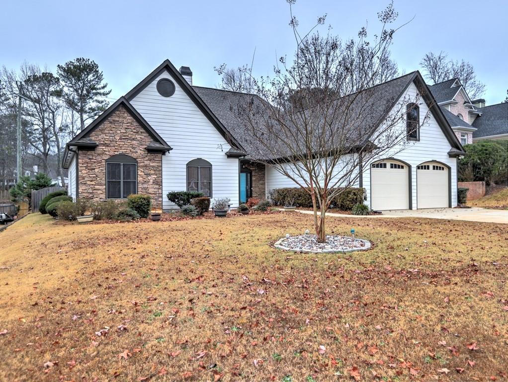 3221 Summer Stream Lane Kennesaw, GA 30152 - Photo 2 of 20 a front view of a house with a yard