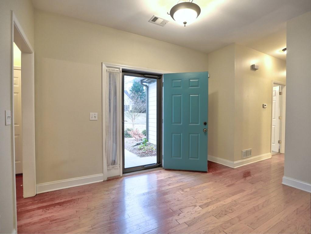 3221 Summer Stream Lane Kennesaw, GA 30152 - Photo 3 of 20 an empty room with closet and wooden floor