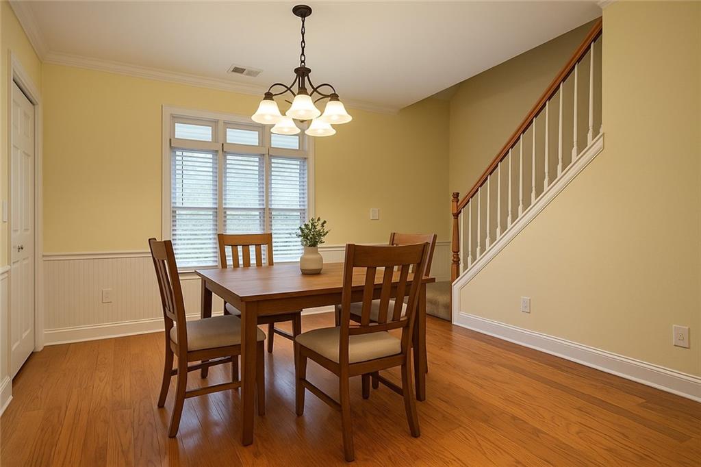 3221 Summer Stream Lane Kennesaw, GA 30152 - Photo 10 of 20 a view of a dining room with furniture wooden floor and chandelier