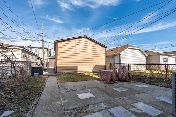 a view of house with backyard
