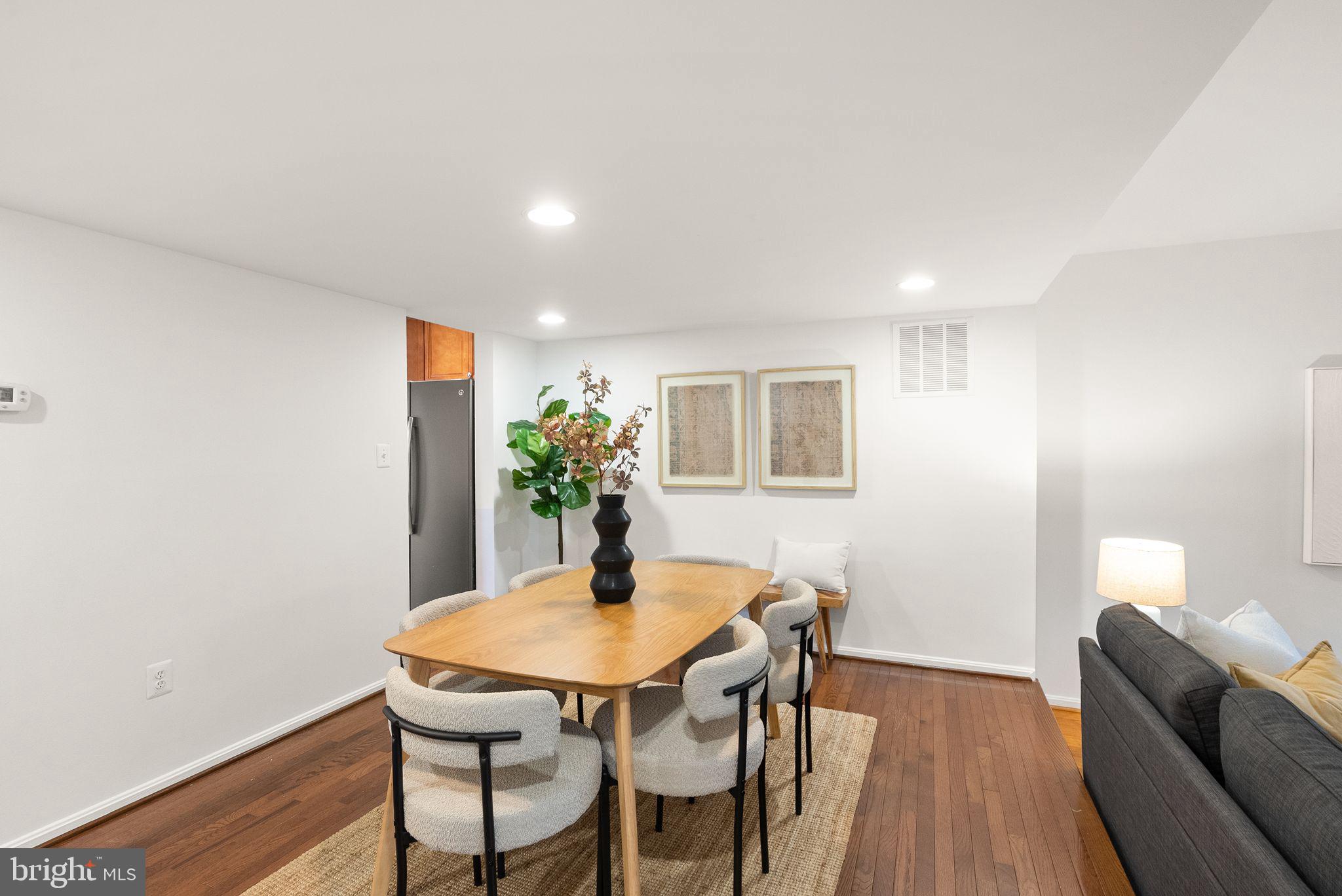 3203 Foothill Street Woodbridge, VA 22192 - Photo 12 of 57 a view of a dining room with furniture and wooden floor