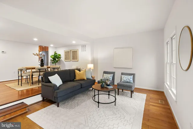 a living room with furniture and a rug
