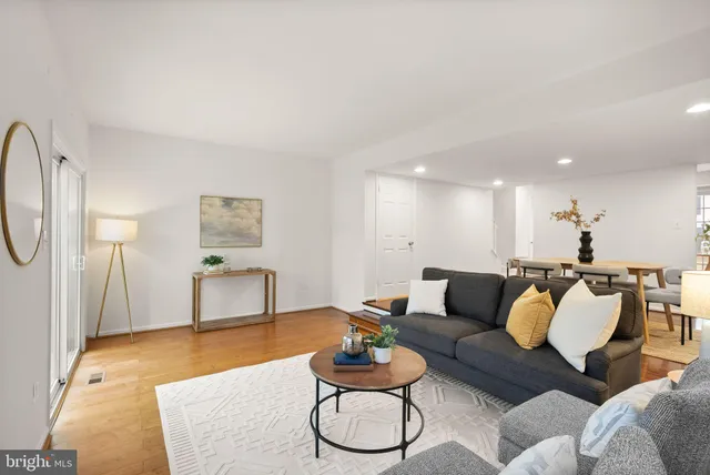 a living room with furniture and a table