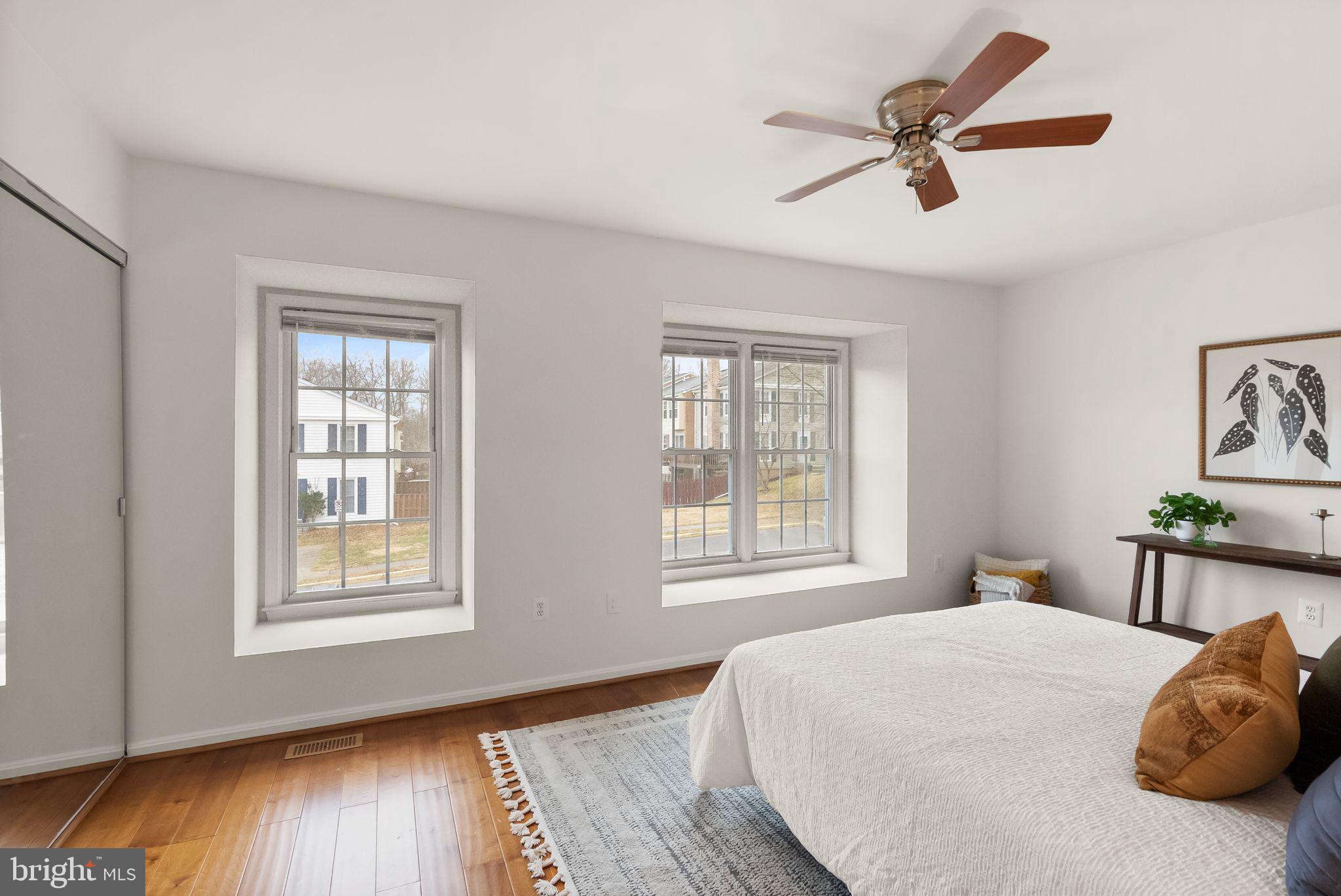 3203 Foothill Street Woodbridge, VA 22192 - Photo 26 of 57 a bedroom with a bed and wooden floor