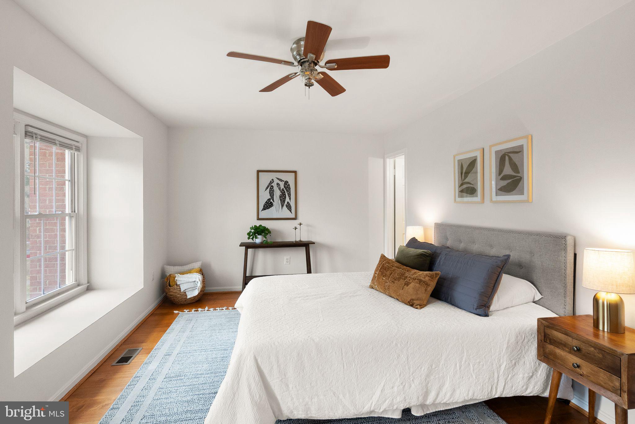 3203 Foothill Street Woodbridge, VA 22192 - Photo 27 of 57 a bedroom with a bed and wooden floor