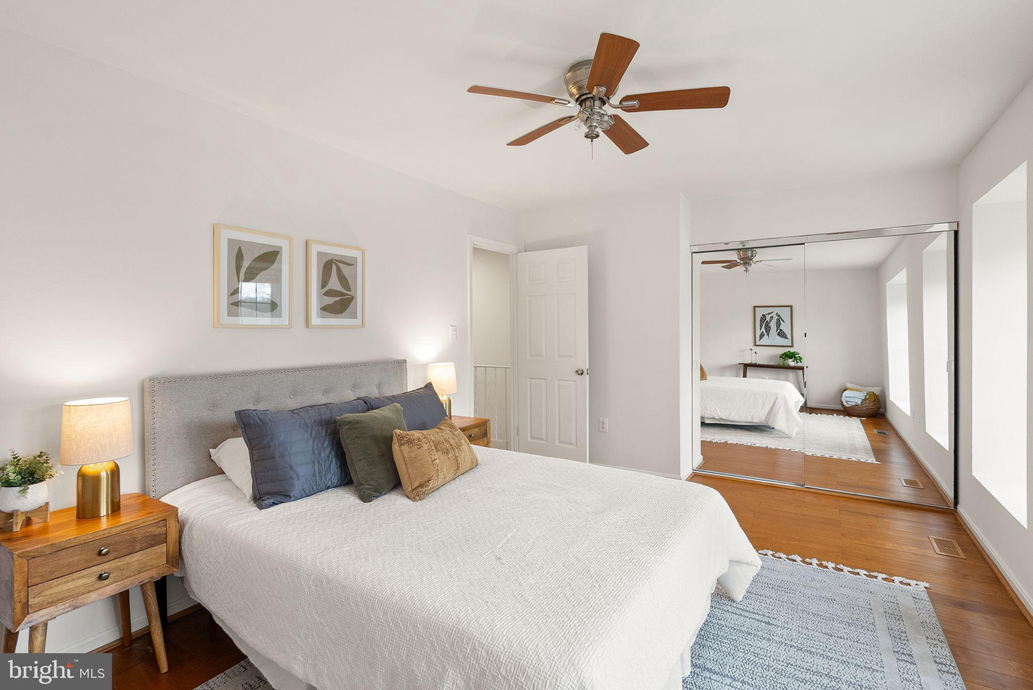 3203 Foothill Street Woodbridge, VA 22192 - Photo 28 of 57 a bedroom with a large bed and a chandelier