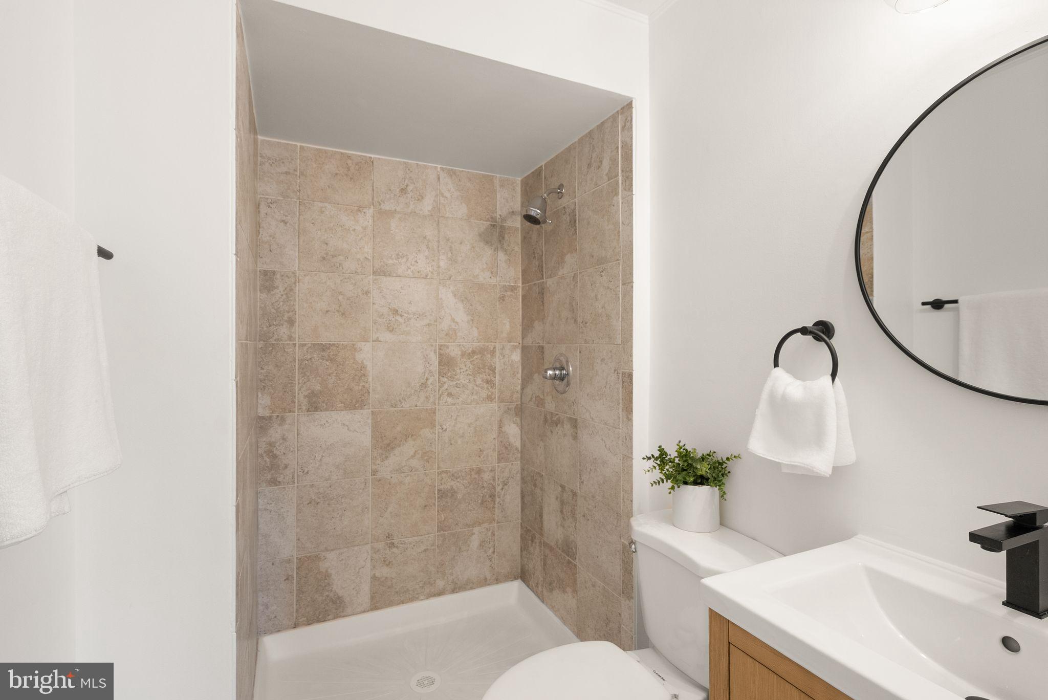 3203 Foothill Street Woodbridge, VA 22192 - Photo 31 of 57 a bathroom with a sink toilet and shower