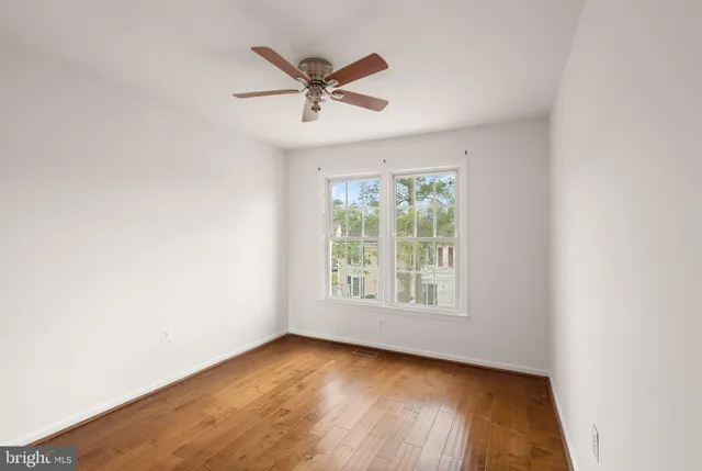 a bathroom with a sink toilet and a mirror
