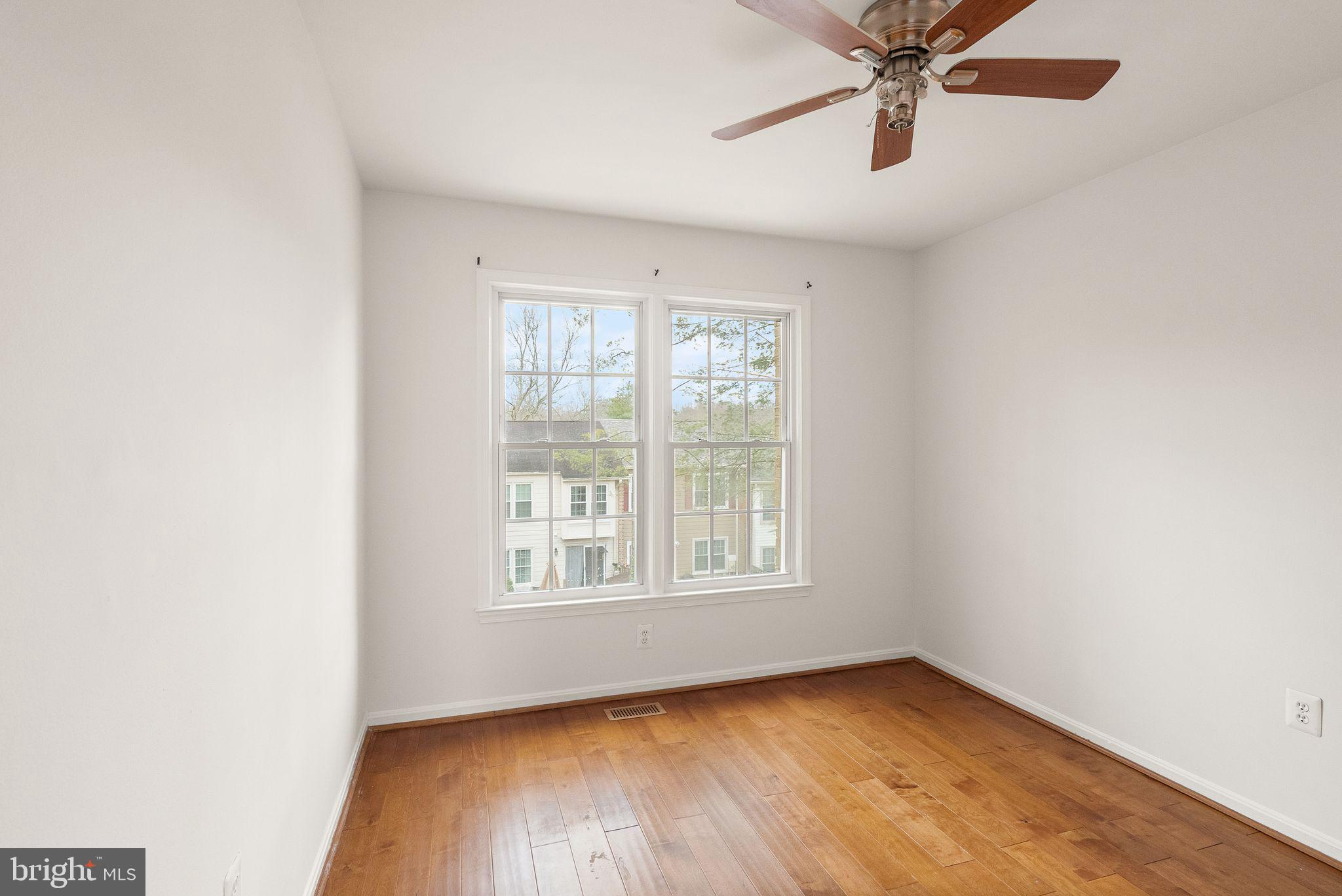 3203 Foothill Street Woodbridge, VA 22192 - Photo 37 of 57 a view of an empty room with a window and wooden floor