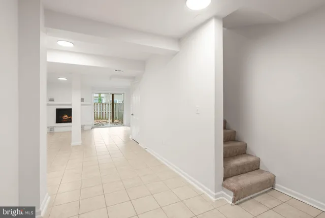 an empty room with fireplace