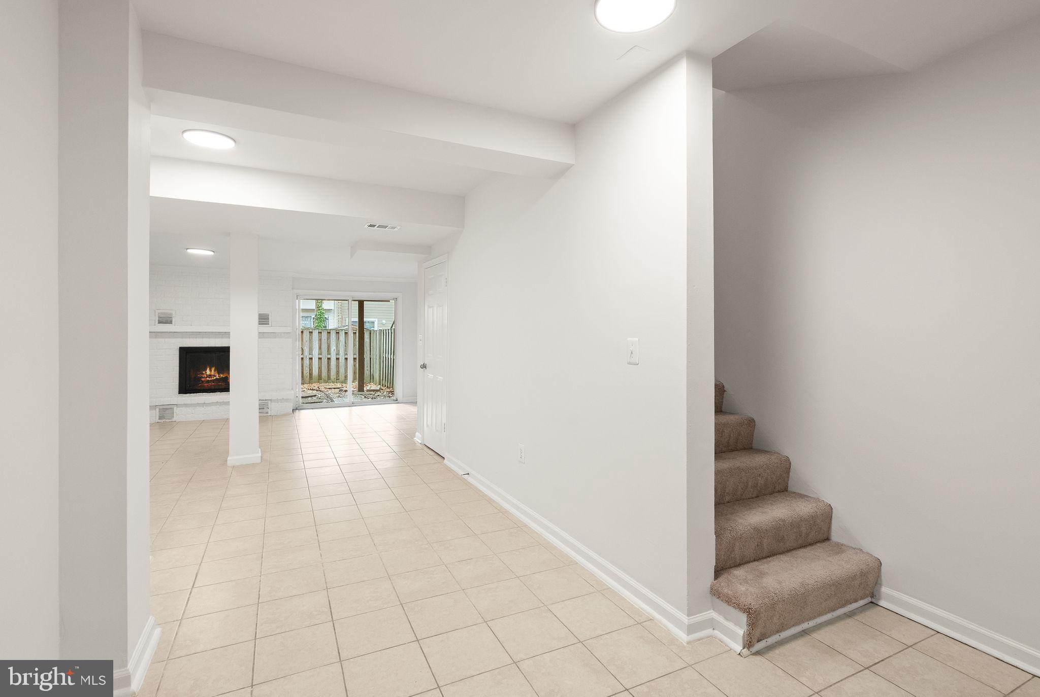 3203 Foothill Street Woodbridge, VA 22192 - Photo 42 of 57 a view of a hallway with furniture and a bathroom