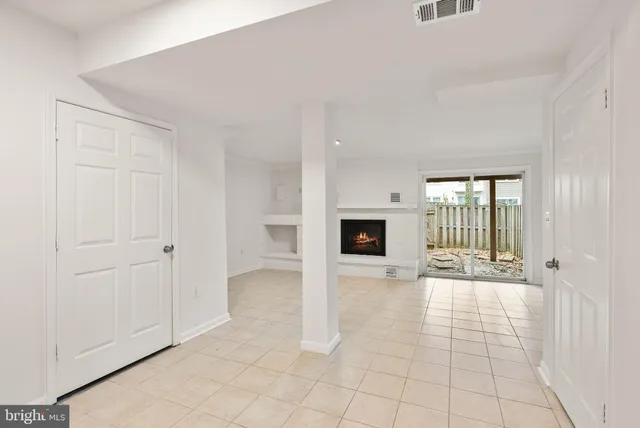 a bathroom with a toilet a sink and a mirror