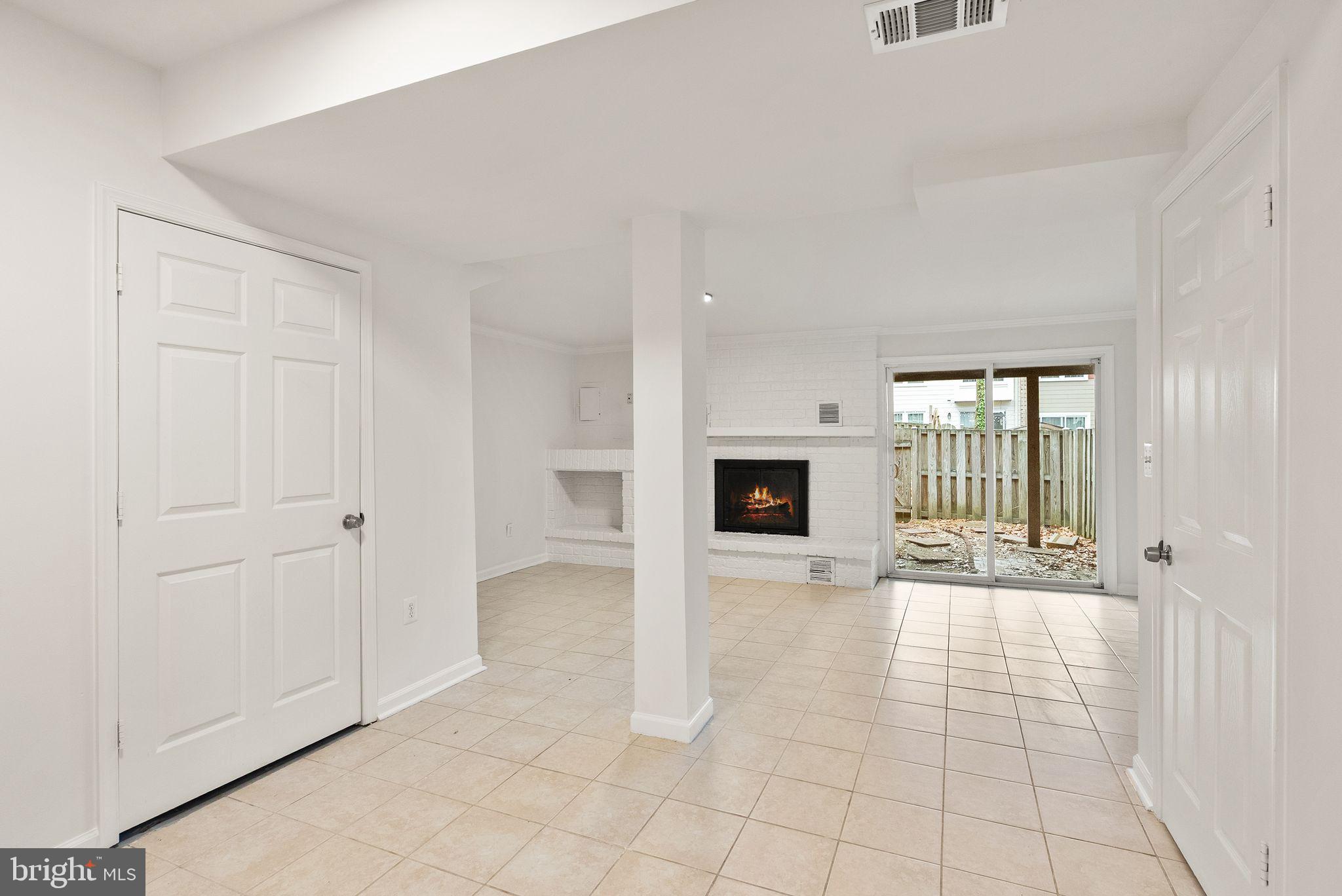 3203 Foothill Street Woodbridge, VA 22192 - Photo 43 of 57 a view of a livingroom with wooden floor and kitchen space with a sink