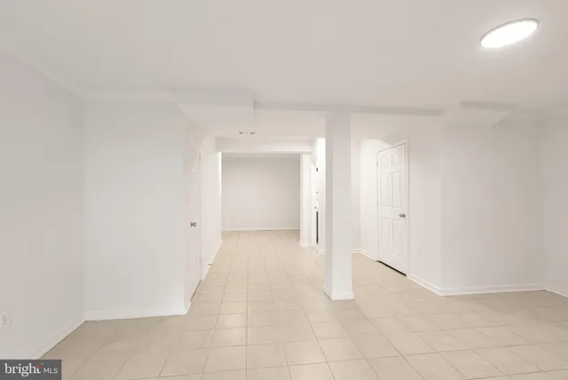 a view of a house with a wooden fence
