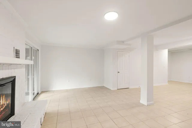 a view of a house with wooden deck and furniture