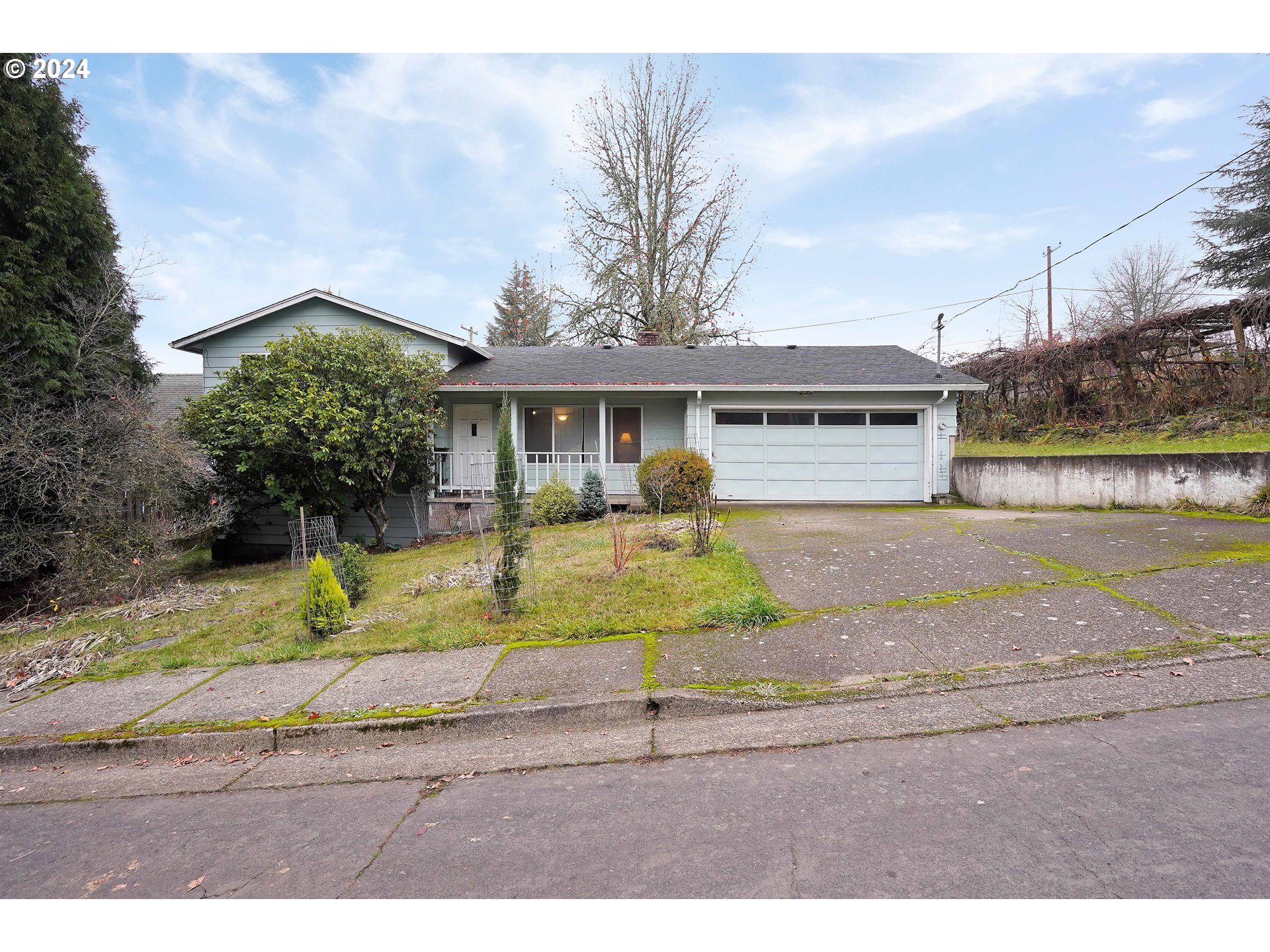 390 Northwest Conifer Boulevard Corvallis, OR 97330 - Photo 1 of 47 a front view of a house with a yard