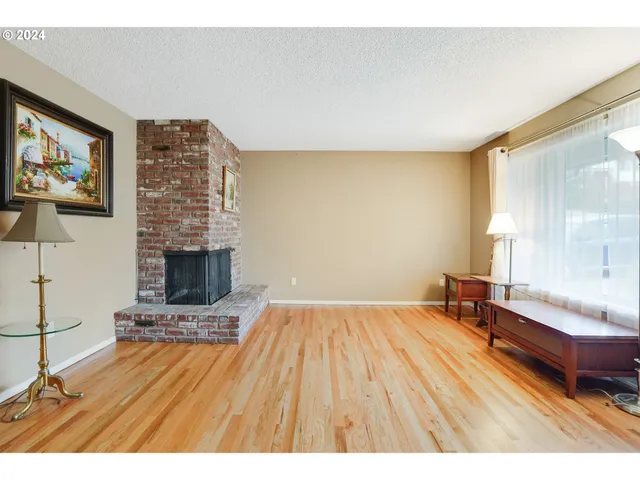 a spacious bedroom with a bed and a fireplace