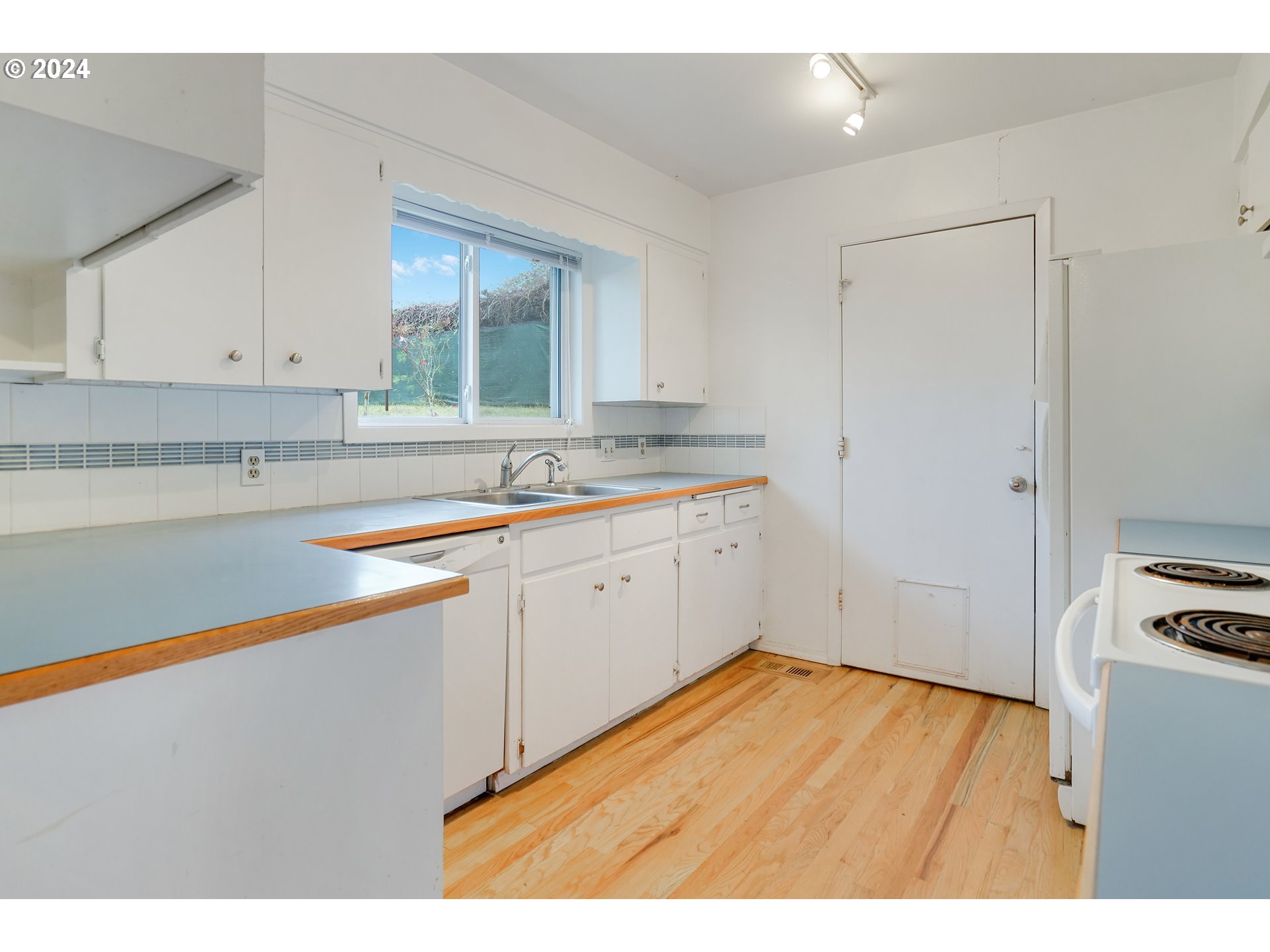 390 Northwest Conifer Boulevard Corvallis, OR 97330 - Photo 16 of 47 a kitchen with a sink cabinets and window