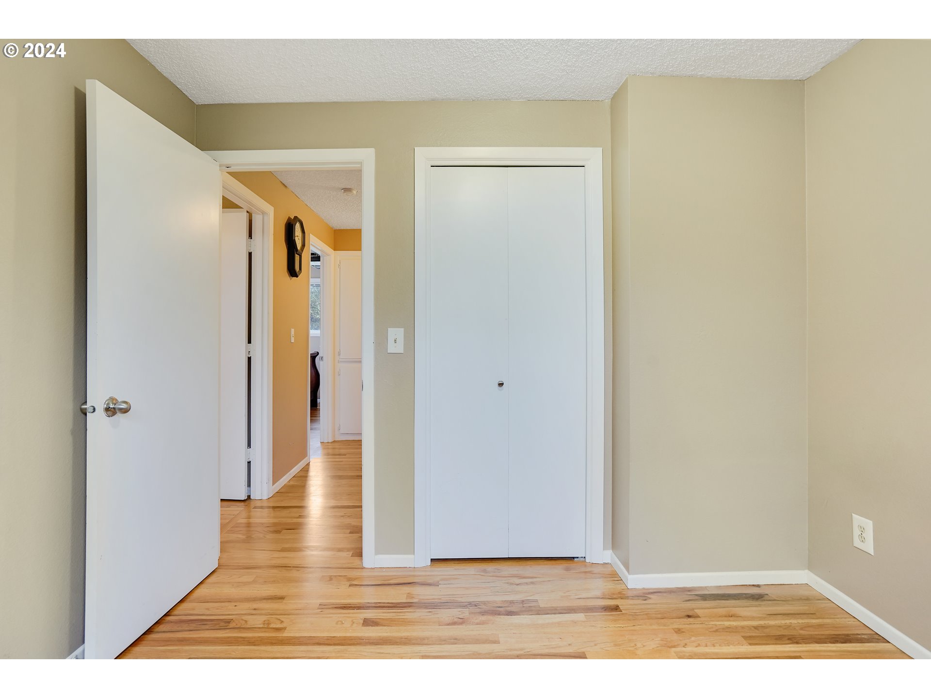 390 Northwest Conifer Boulevard Corvallis, OR 97330 - Photo 18 of 47 a view of a hallway with wooden floor