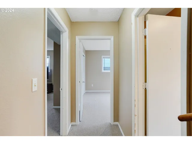 a view of a bathroom with a sink and mirror