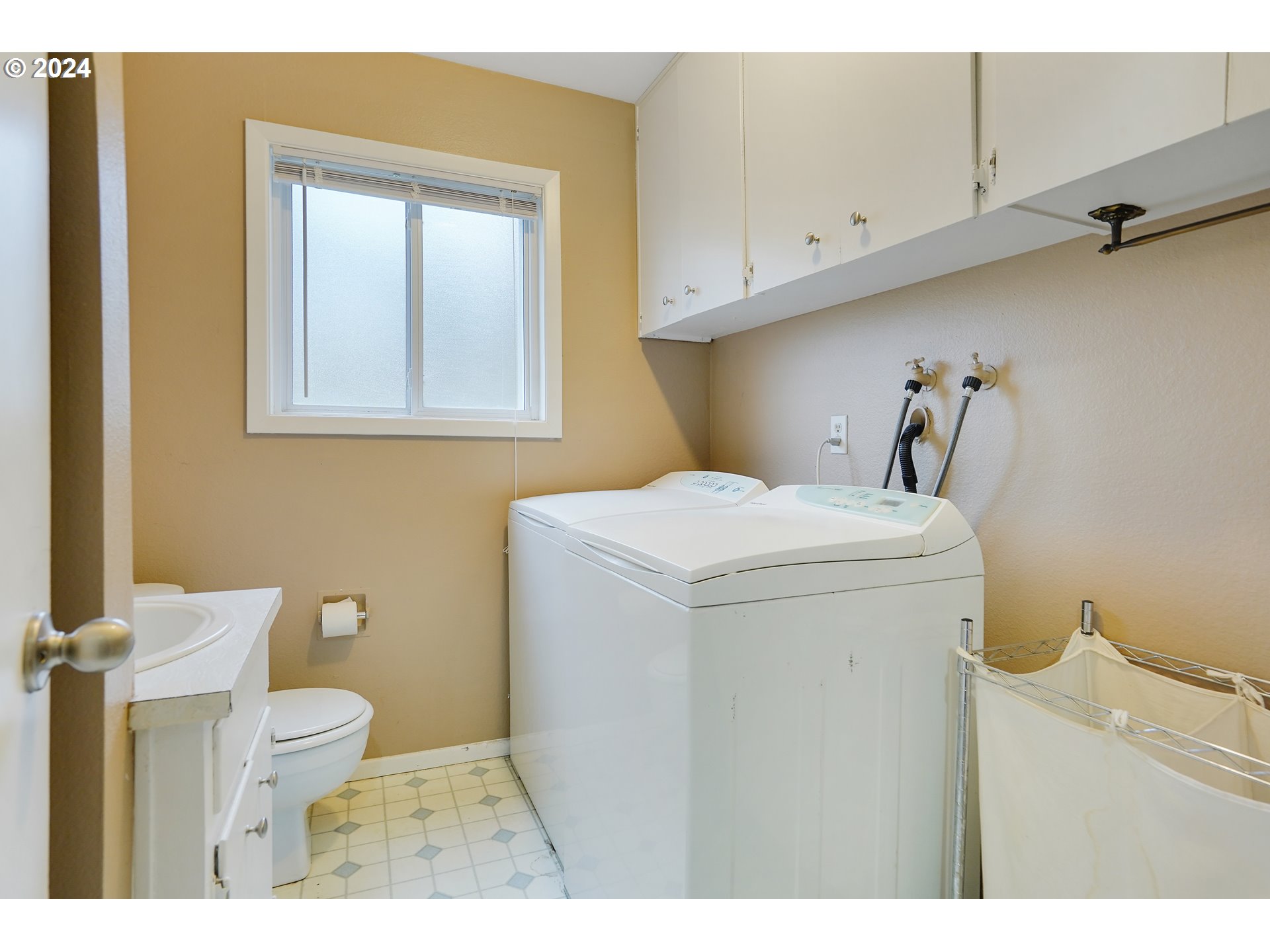 390 Northwest Conifer Boulevard Corvallis, OR 97330 - Photo 32 of 47 a bathroom with a toilet sink and mirror