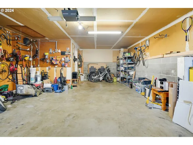a view of a garage with a bike and car