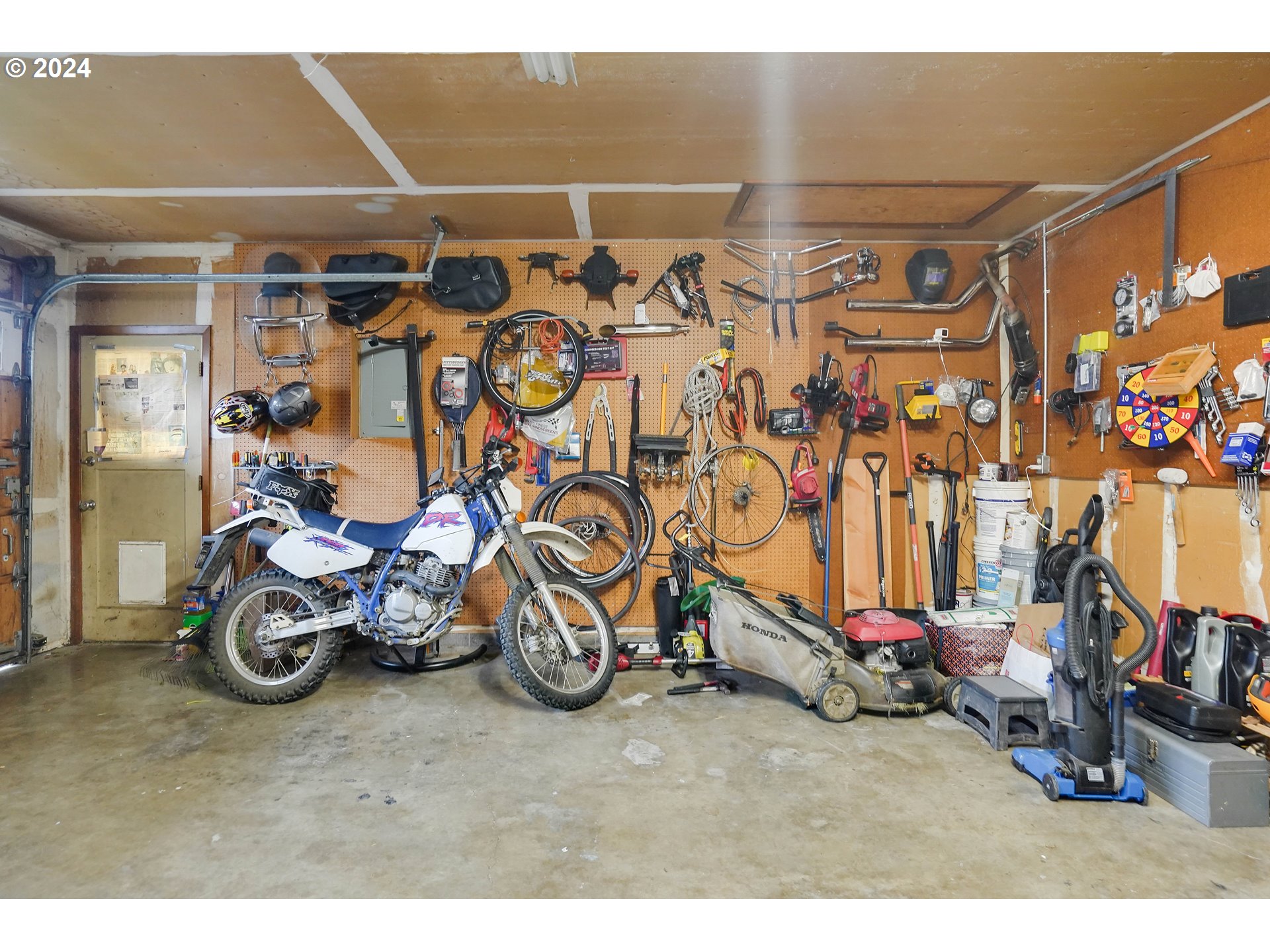 390 Northwest Conifer Boulevard Corvallis, OR 97330 - Photo 38 of 47 a view of a garage with a bike and car