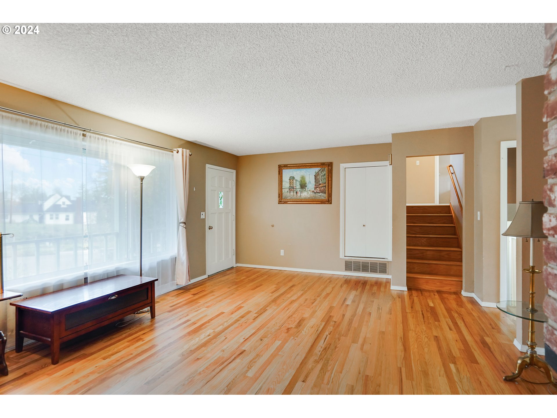 390 Northwest Conifer Boulevard Corvallis, OR 97330 - Photo 5 of 47 a bedroom with a bed and wooden floor