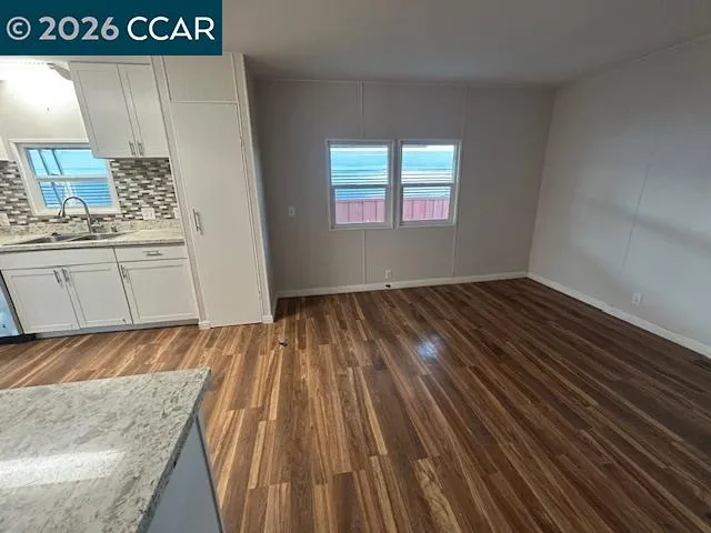 a view of a kitchen from the hallway
