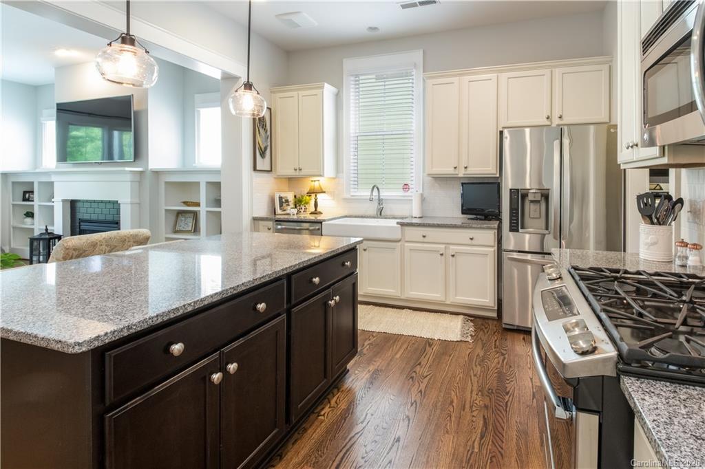 440 Hollyhock Lane Fort Mill, SC 29708 - Photo 4 of 28 a kitchen with stainless steel appliances granite countertop a sink stove and refrigerator