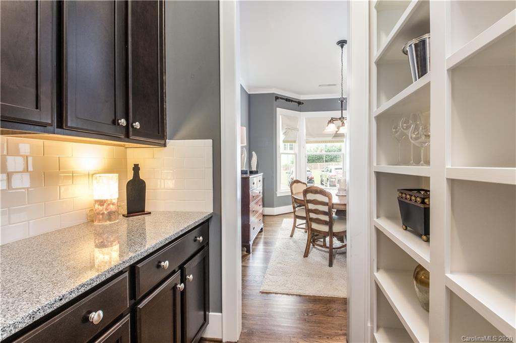 440 Hollyhock Lane Fort Mill, SC 29708 - Photo 9 of 28 a kitchen with granite countertop a sink a counter top space and cabinets