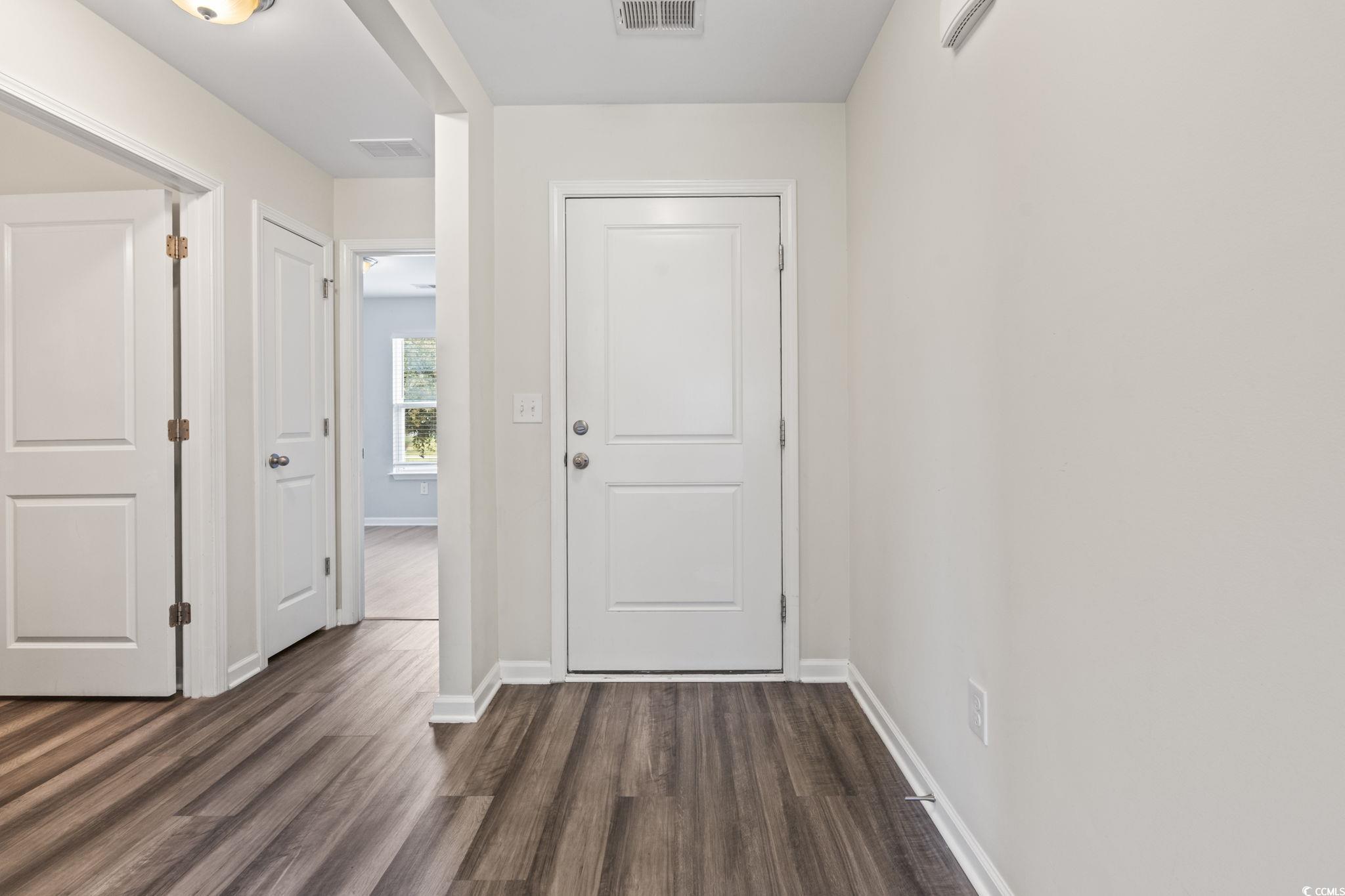 3151 Holly Loop Conway, SC 29527 - Photo 11 of 31 Foyer with dark wood finished floors and baseboards