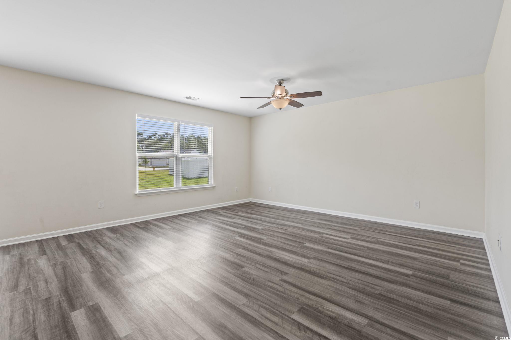 3151 Holly Loop Conway, SC 29527 - Photo 16 of 31 Livingroom featuring a ceiling fan and dark wood-type flooring