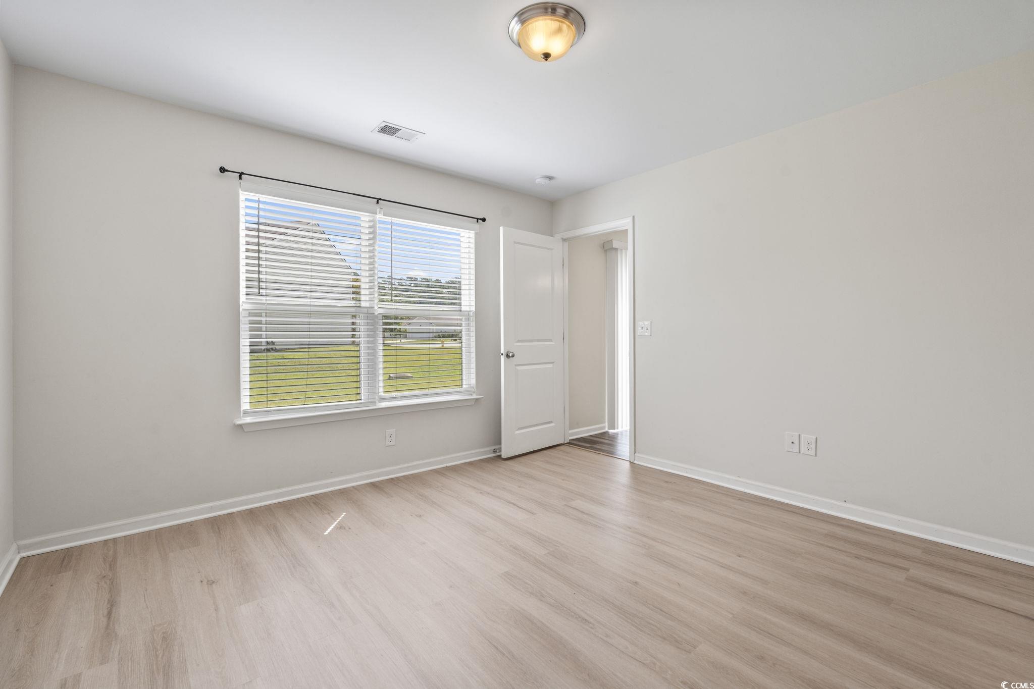 3151 Holly Loop Conway, SC 29527 - Photo 18 of 31 Master bedroom featuring wood finished floors