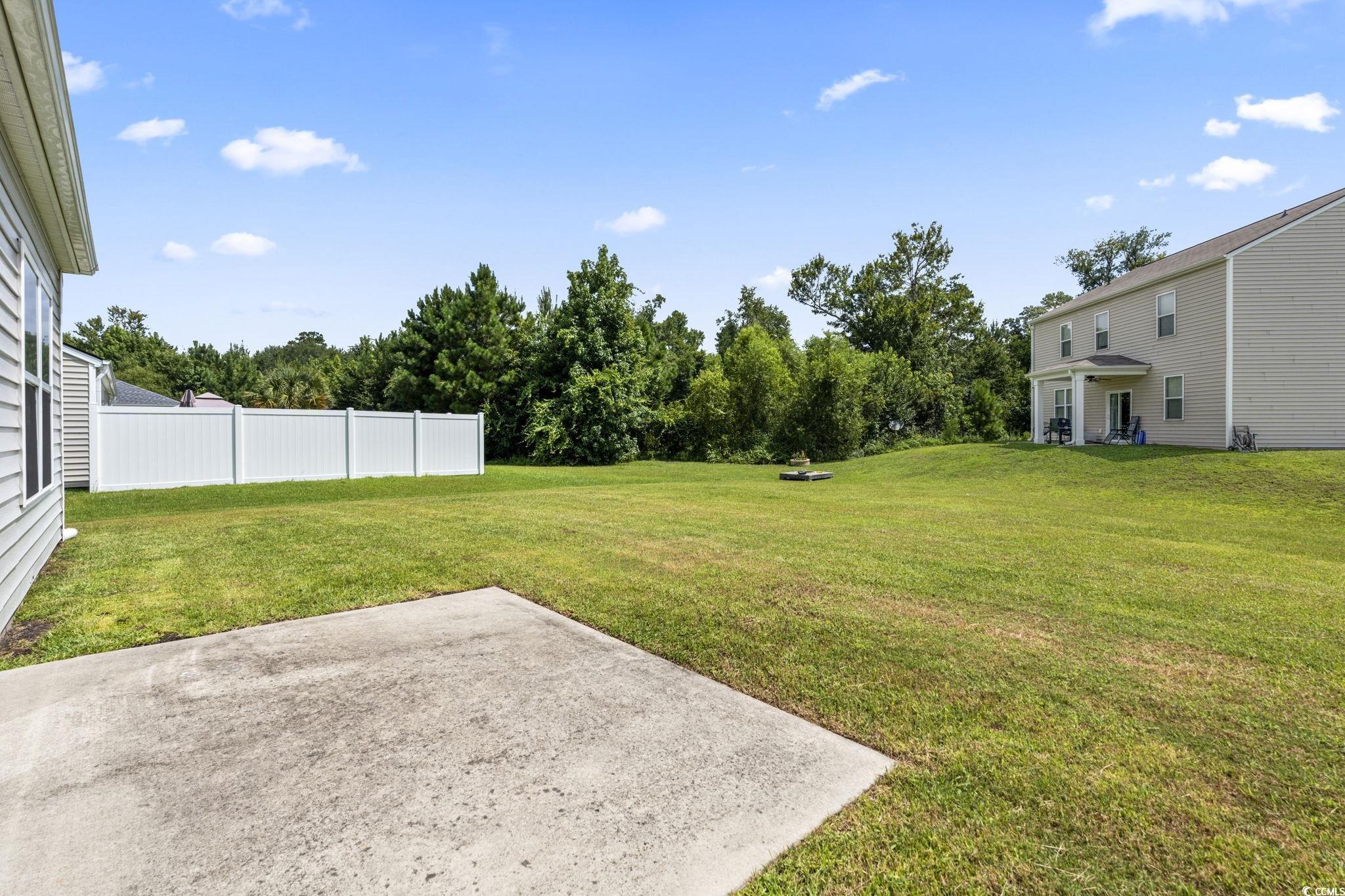 3151 Holly Loop Conway, SC 29527 - Photo 25 of 31 View of yard featuring a patio and view of wooded area