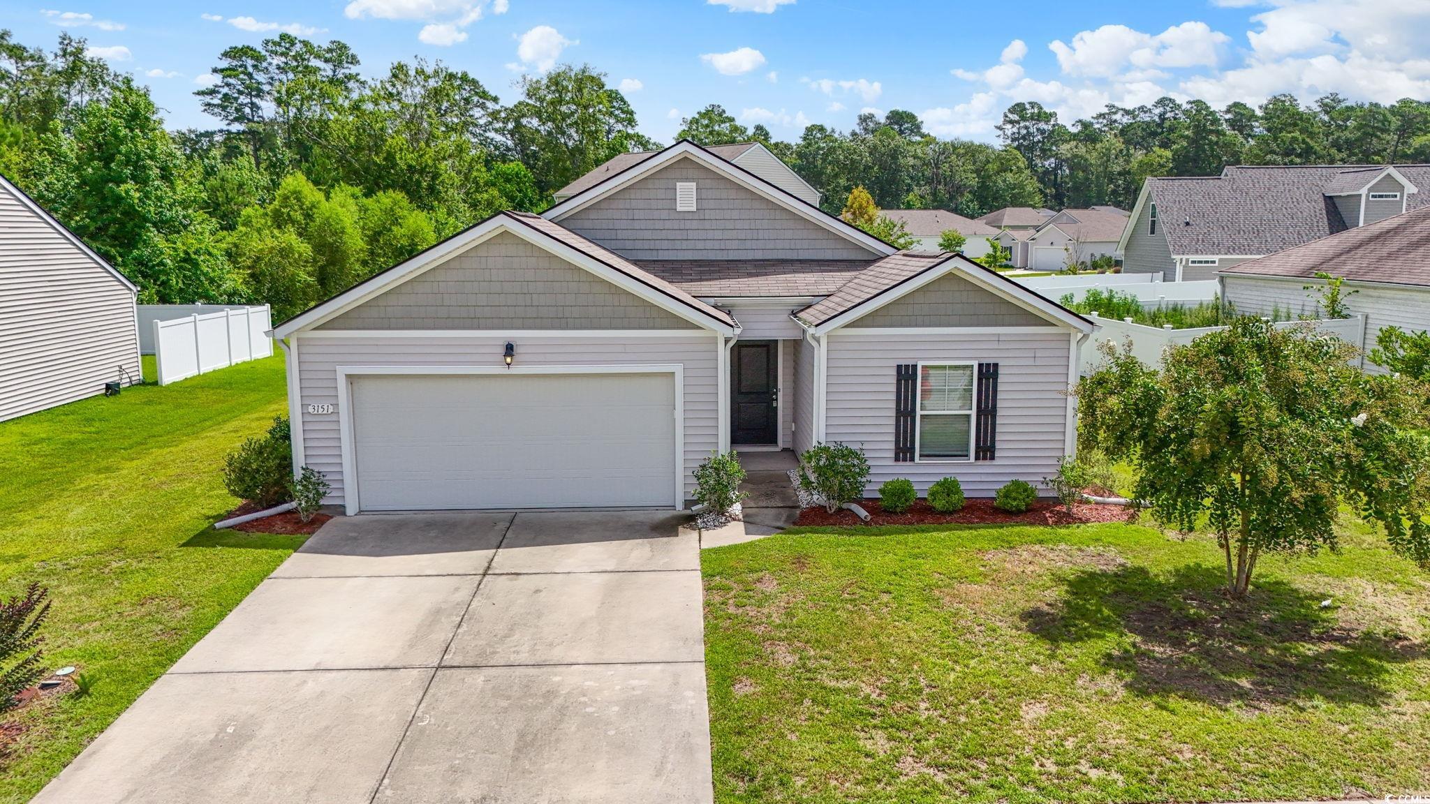 3151 Holly Loop Conway, SC 29527 - Photo 29 of 31 View of front of house featuring driveway, a garage, and a residential view