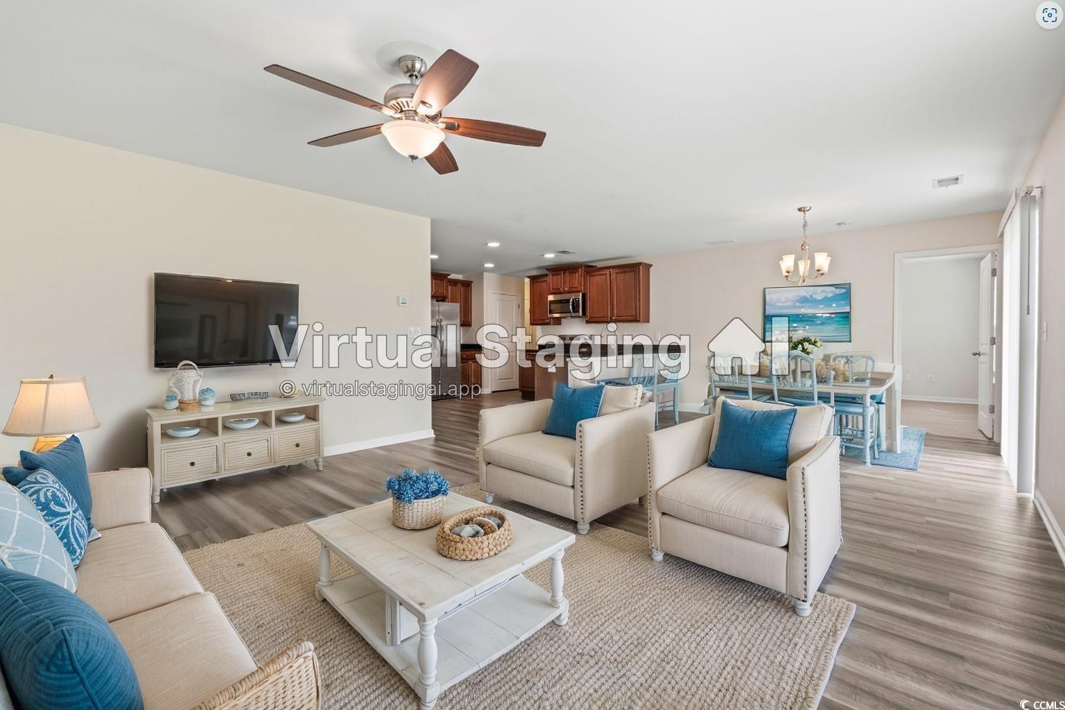 3151 Holly Loop Conway, SC 29527 - Photo 3 of 31 Living room with a chandelier, light wood-style flooring, and a ceiling fan