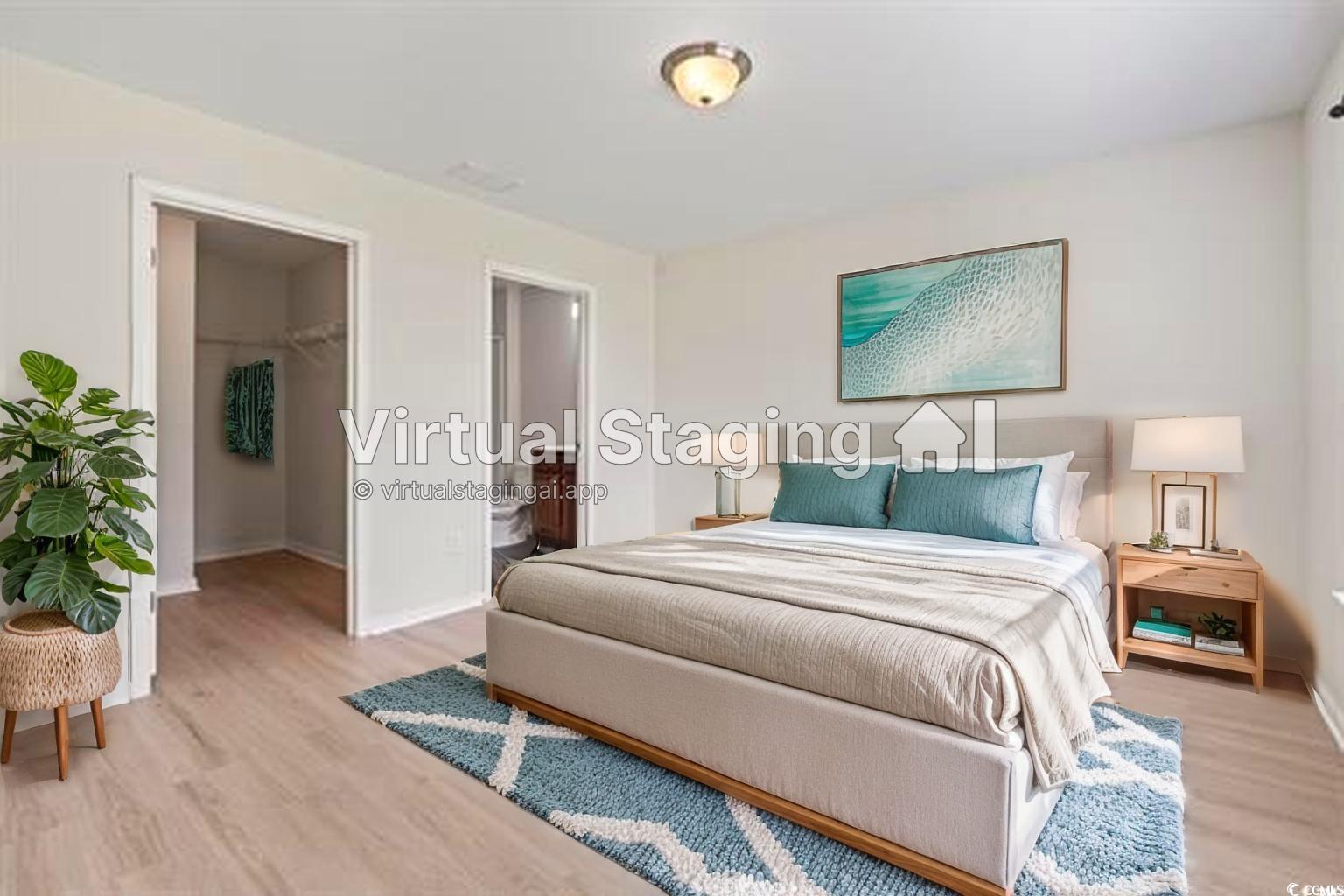 3151 Holly Loop Conway, SC 29527 - Photo 6 of 31 Bedroom featuring a walk in closet and light wood-style flooring