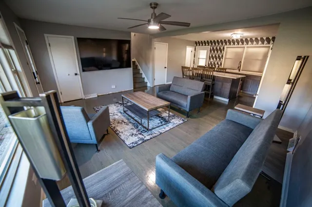 a living room with furniture and a flat screen tv