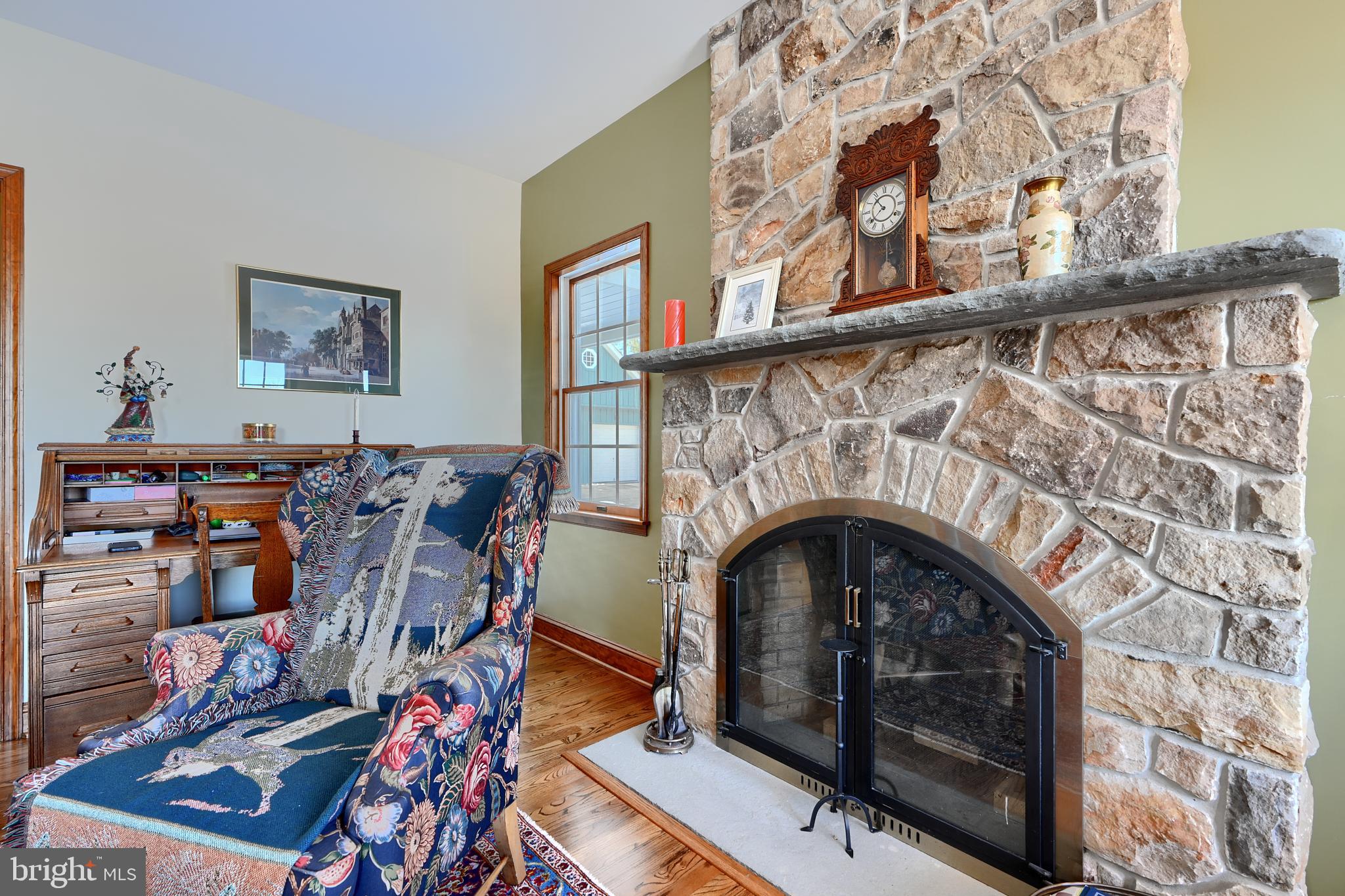 19824 Valley Mill Road Freeland, MD 21053 - Photo 21 of 72 a living room with furniture and a fireplace