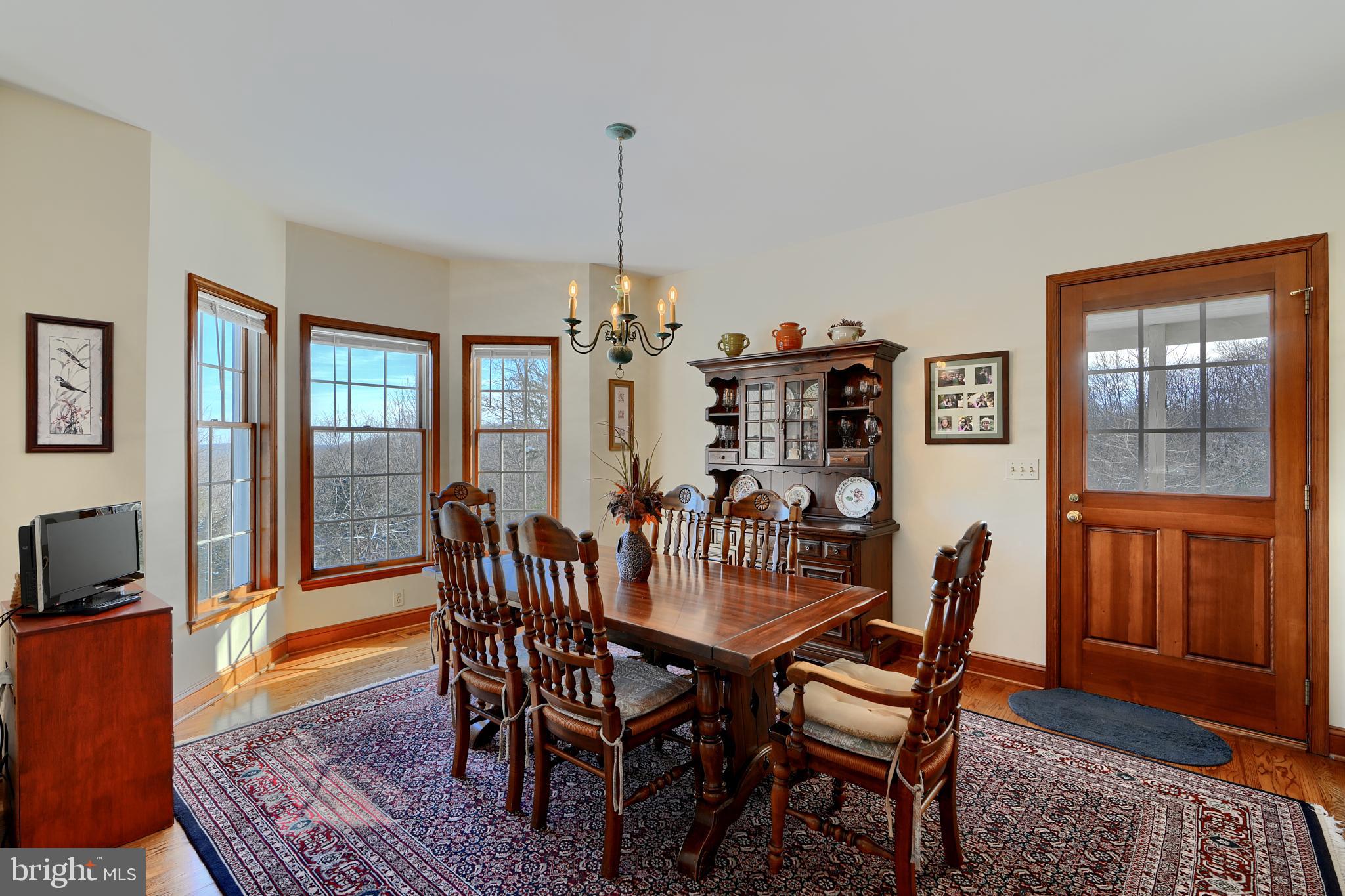 19824 Valley Mill Road Freeland, MD 21053 - Photo 24 of 72 a view of a dining room with furniture window and wooden floor