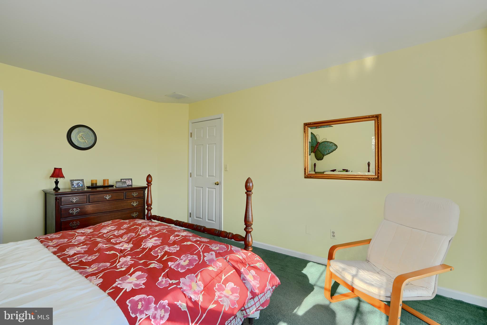 19824 Valley Mill Road Freeland, MD 21053 - Photo 54 of 72 a bedroom with a bed and chair
