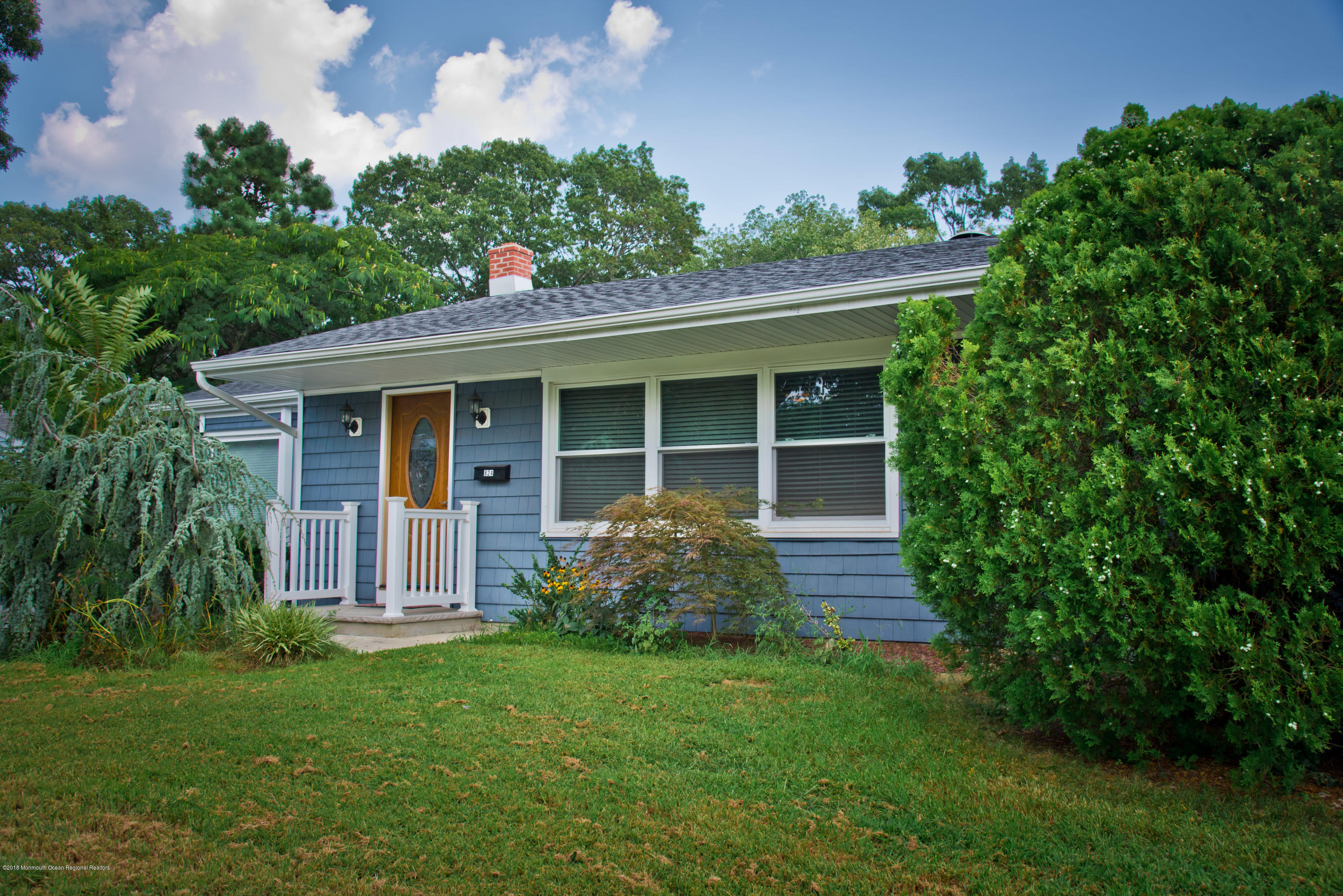 824 Beaver Dam Road Point Pleasant, NJ 08742 - Photo 1 of 35 a front view of a house with garden