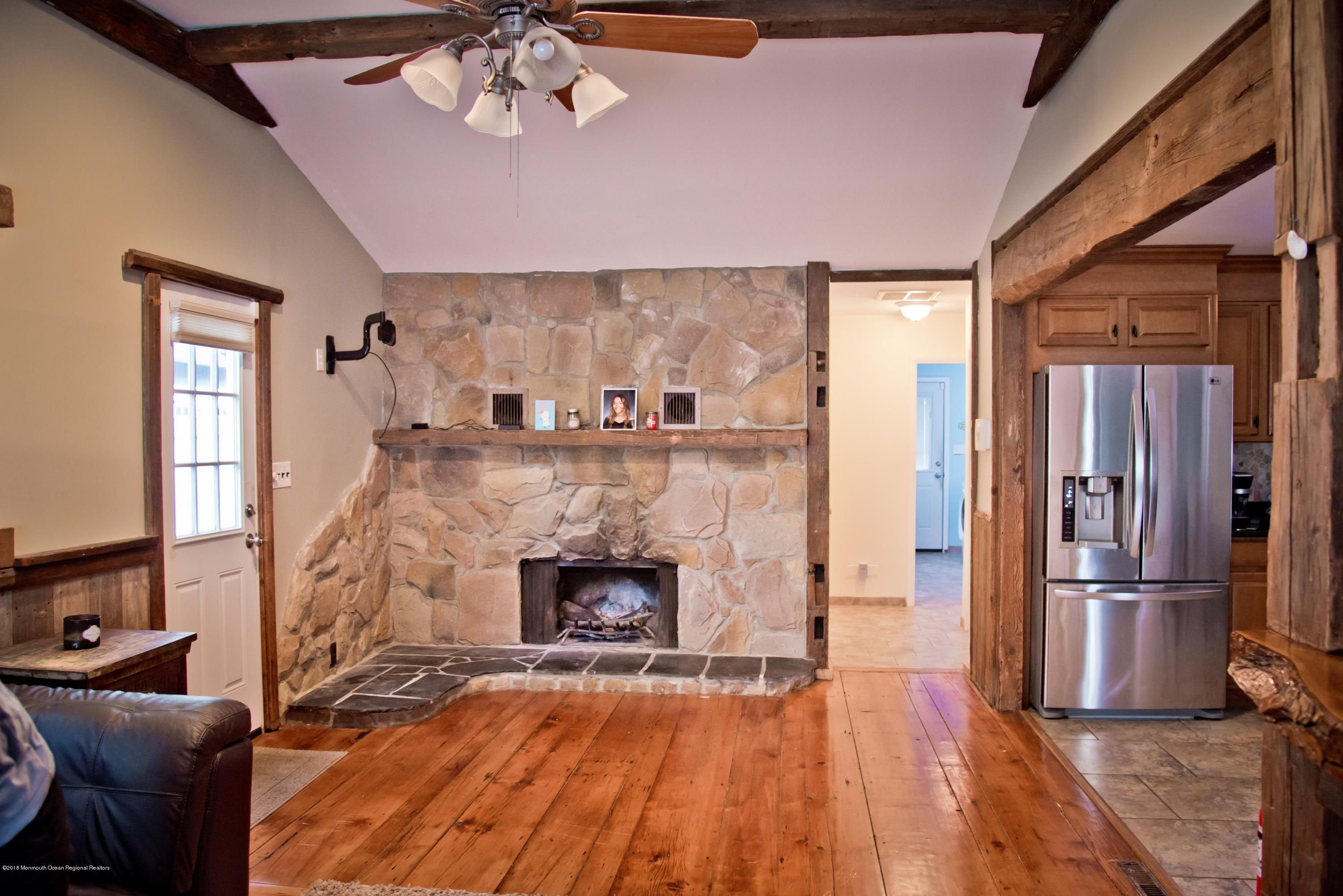 824 Beaver Dam Road Point Pleasant, NJ 08742 - Photo 15 of 35 a living room with furniture and a fireplace