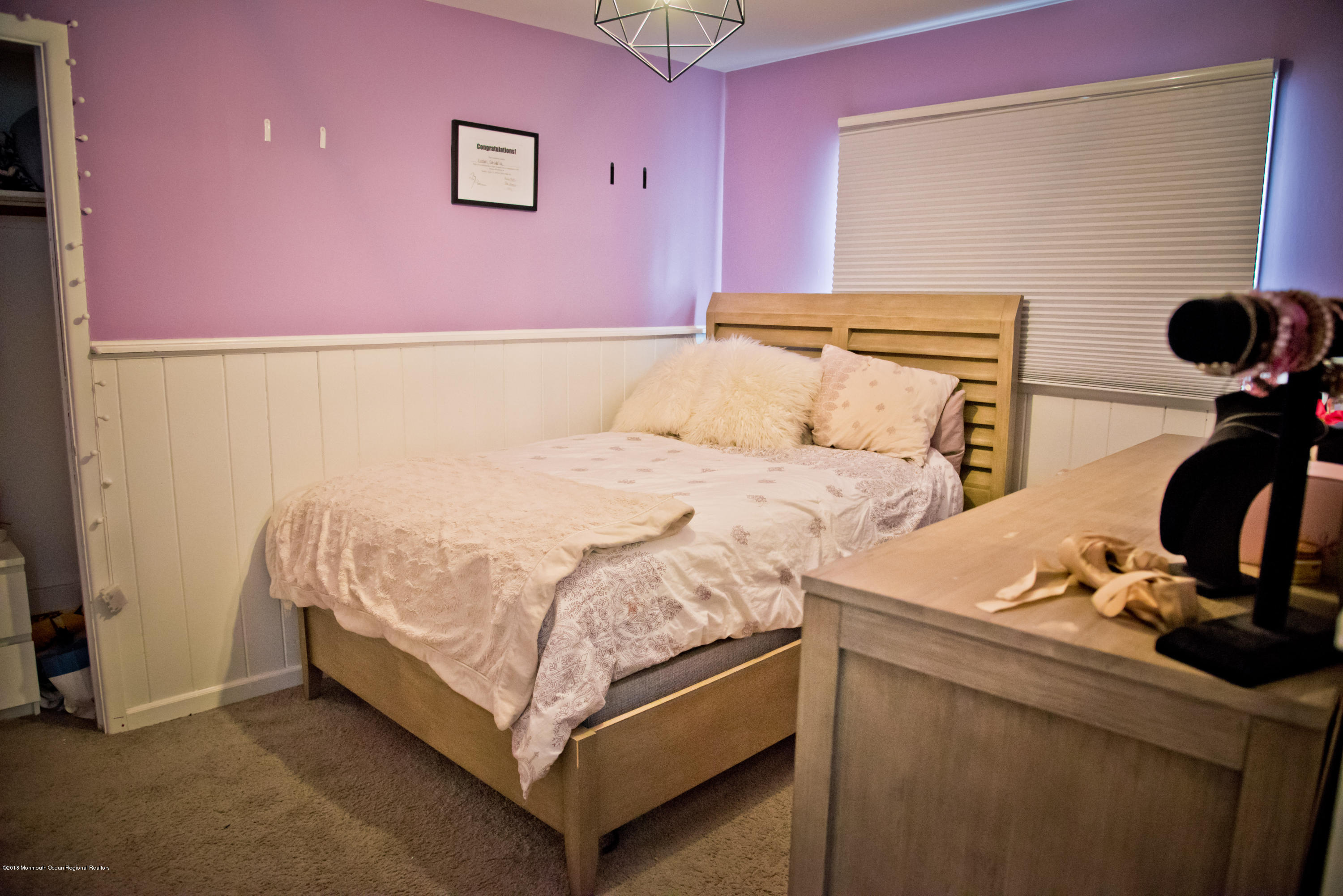 824 Beaver Dam Road Point Pleasant, NJ 08742 - Photo 21 of 35 a bedroom with a bed and cabinets