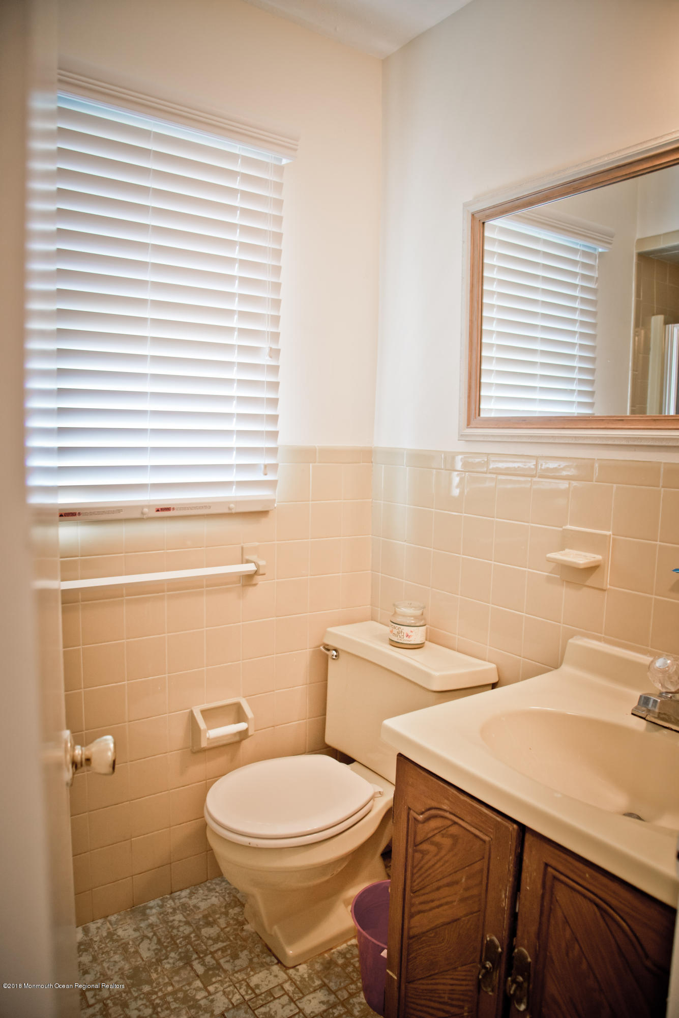 824 Beaver Dam Road Point Pleasant, NJ 08742 - Photo 23 of 35 a bathroom with a sink a toilet and a window