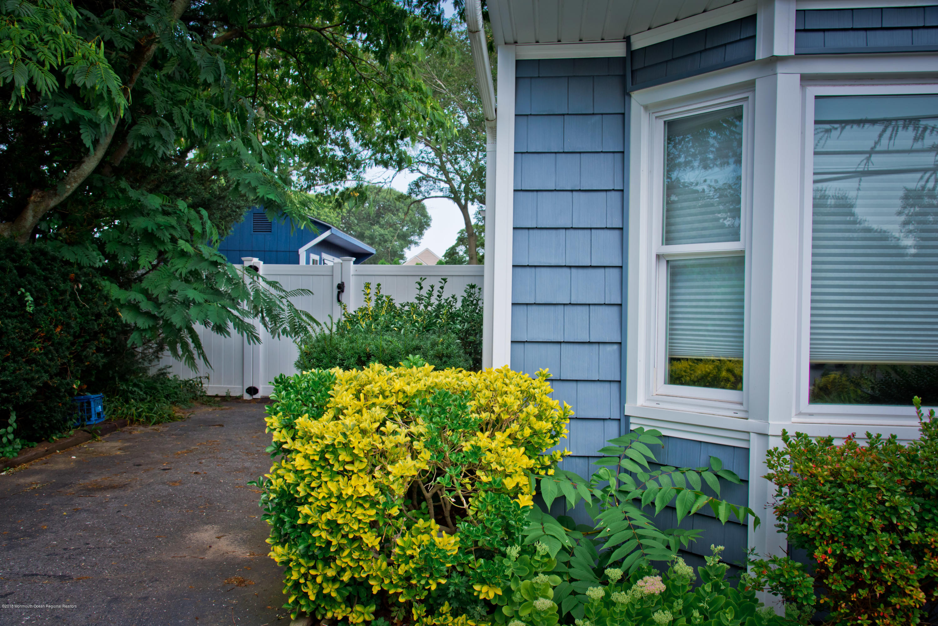 824 Beaver Dam Road Point Pleasant, NJ 08742 - Photo 3 of 35 a view of a backyard with potted plants