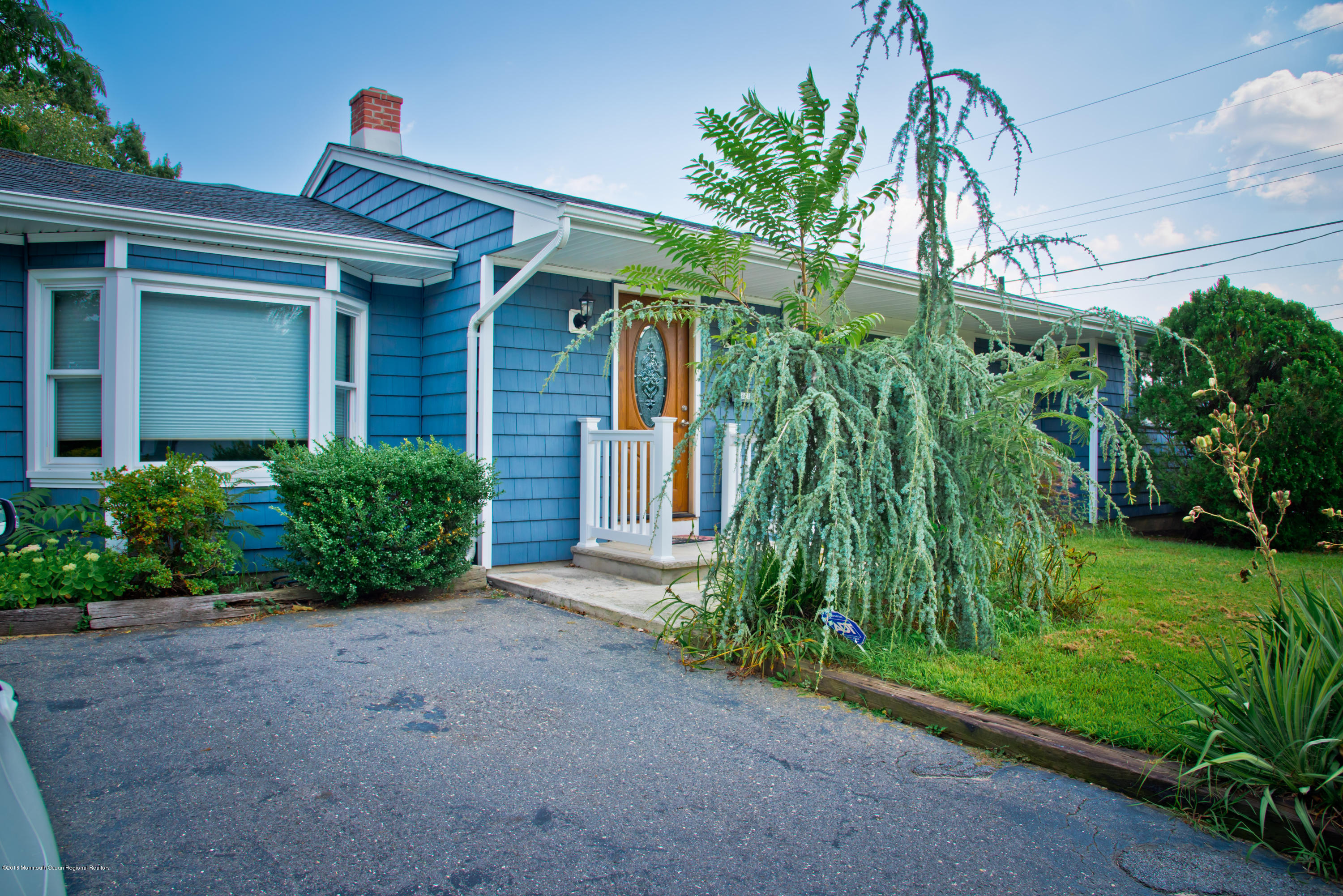 824 Beaver Dam Road Point Pleasant, NJ 08742 - Photo 7 of 35 a front view of a house with a plant