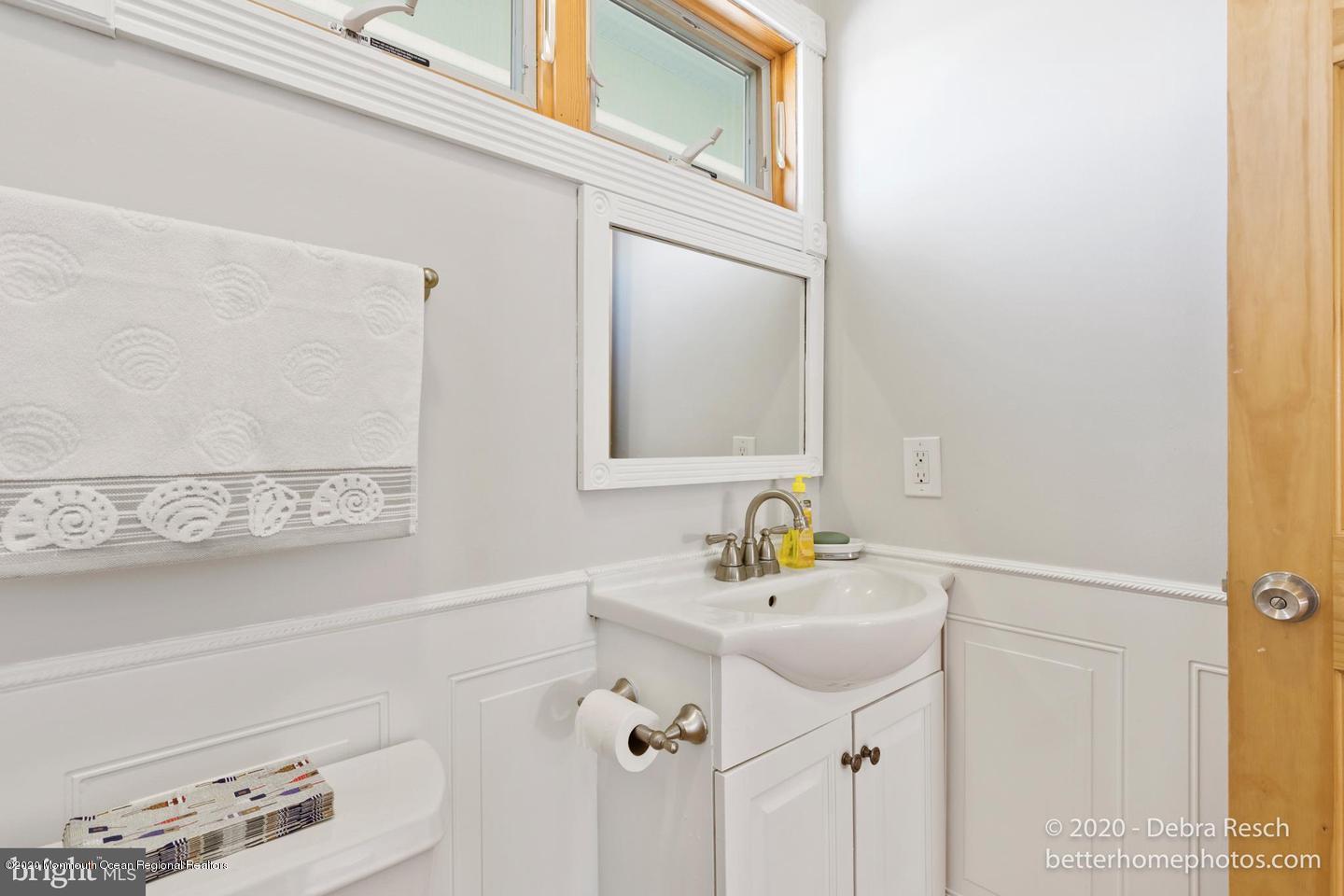 107 Parker Road Tuckerton, NJ 08087 - Photo 14 of 37 a bathroom with a sink and a mirror
